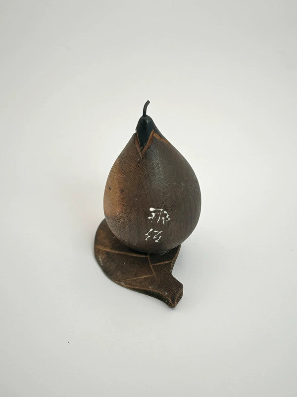 K05035 - Vintage aubergine omiyage doll from Nasua