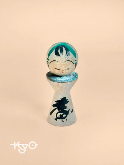 K05040 - Miniature Kokeshi with 5 Yen Coin