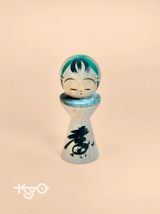 K05040 - Miniature Kokeshi with 5 Yen Coin