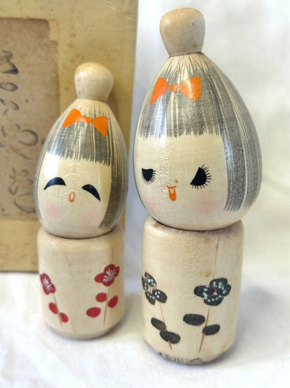 One pair of Japanese kokeshi by Seiju
