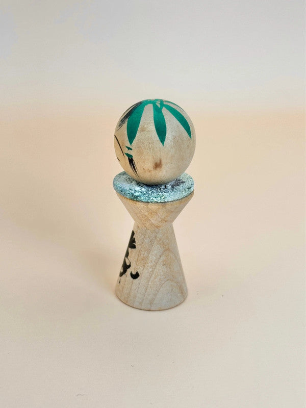 K05040 - Miniature Kokeshi with 5 Yen Coin