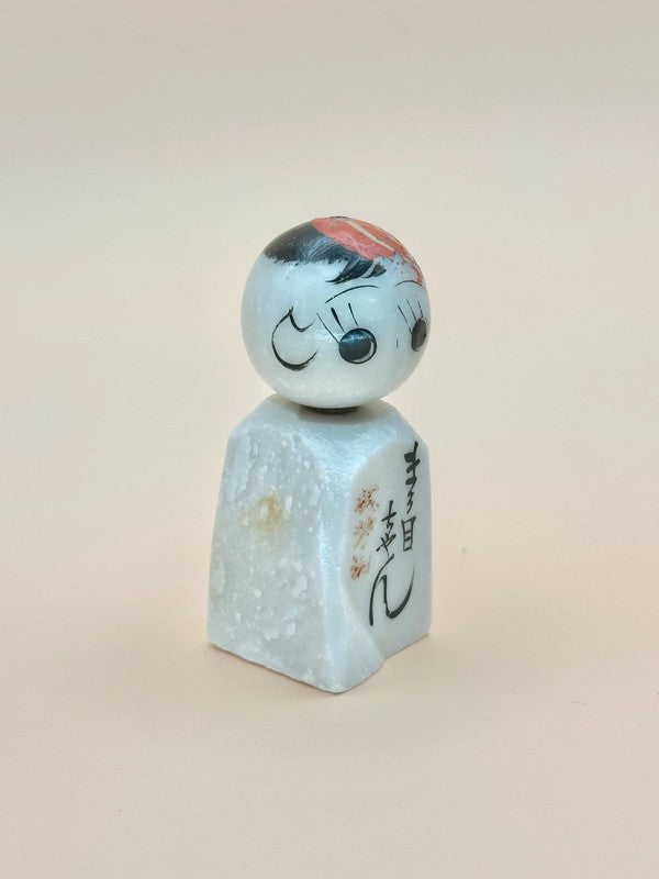 K05006 - Omiyage kokeshi doll in stone