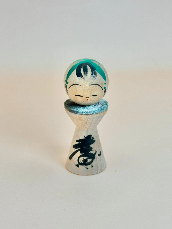 K05040 - Miniature Kokeshi with 5 Yen Coin