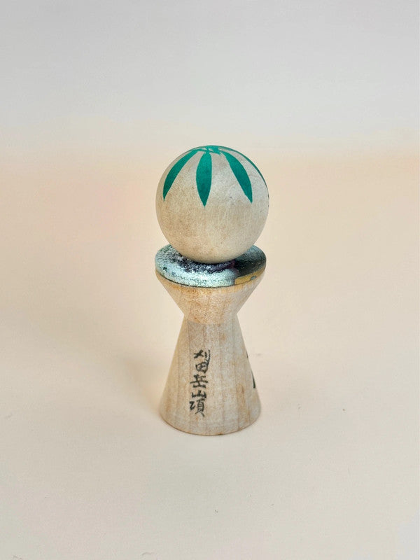 K05040 - Miniature Kokeshi with 5 Yen Coin