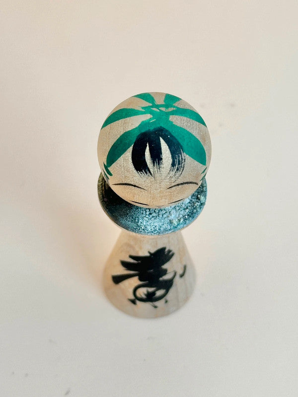 K05040 - Miniature Kokeshi with 5 Yen Coin