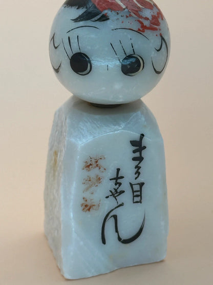 K05006 - Omiyage kokeshi doll in stone