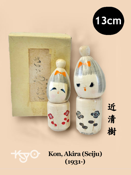 One pair of Japanese kokeshi by Seiju