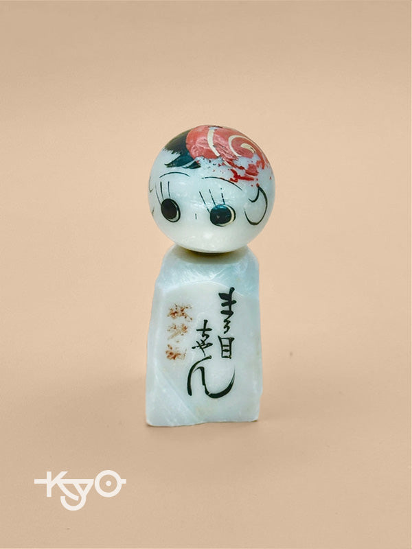 K05006 - Omiyage kokeshi doll in stone