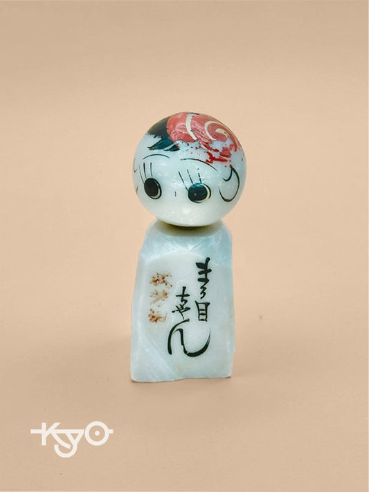 K05006 - Omiyage kokeshi doll in stone